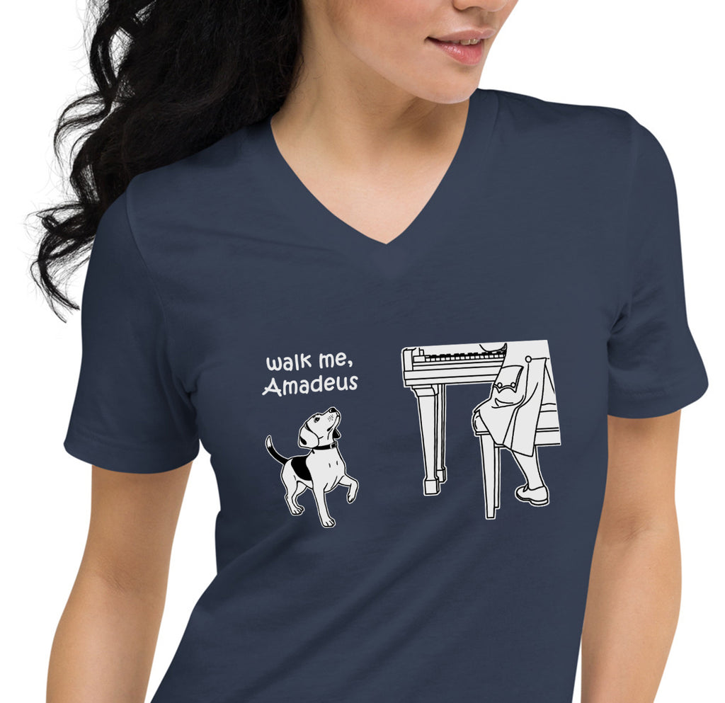 A woman wearing a navy blue V-neck t-shirt with a white graphic print of a beagle and a piano player with the caption, 'Walk me, Amadeus'.